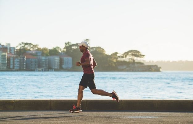 man running near sea during daytime | How an Active Lifestyle Can Prolong Your Life and Reduce Health Issues | Live Like a Rock Star (and Still Be Healthy)