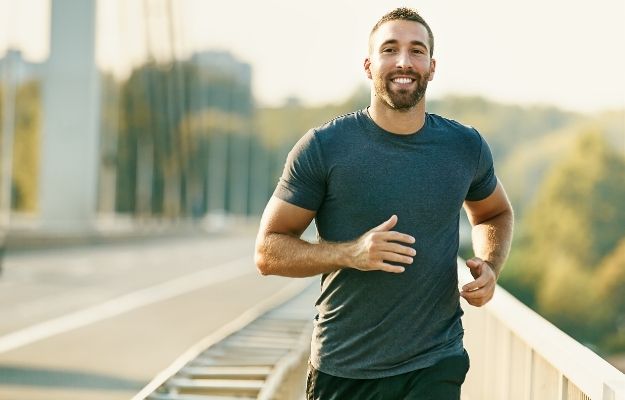 happy man is running on the bridge | Delays Neurodegeneration | Benefits of Spermidine for Cell Renewal