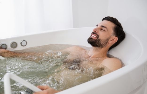 man is taking a warm soak | How to Decompress After a Long Day | How to Decompress After a Long Day