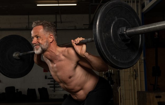 Portrait-of-a-middle-aged-strong-athlete-who-is-doing-weight-training-in-a-gym-----------BETTER-BALANCE-----------_body | The Benefits of Strength Training in Your 40’s and 50’s | BETTER-BALANCE