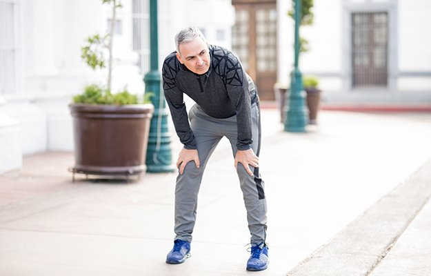 A middle aged man getting tired from walking | 6 Ways To Battle Sarcopenia (Muscle Loss) And Become Physically Fit