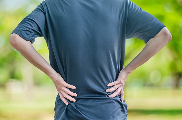man-holding-his-back-in-pain-What-Is-Dhea-ss-body | 5 Signs Of Hormonal Belly & How To Get Rid of It