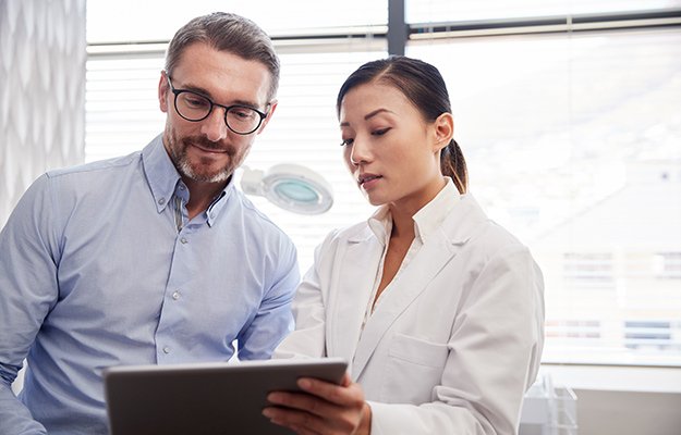 A man having a health consulting with doctor | How Does BHRT Help with Weight Loss?