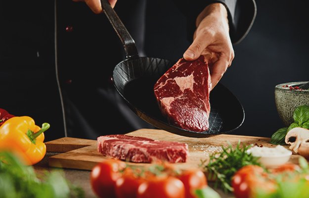 Chef making the delicious healthy steak | Are Keto & Low Carb Diets Better Than Low Fat?