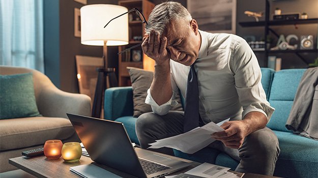 Exhausted businessman working from home late at ni… Syndrome and What Can You Do About It