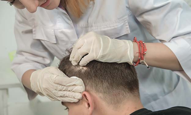 Man getting treatment for hair thinning | Solutions for Thinning Hair in Men | Solutions for Thinning Hair in Men | How to Tell if Your Hair is Thinning