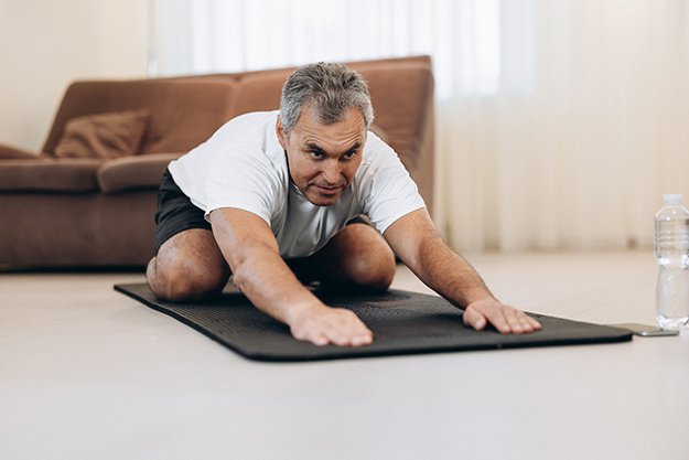Practicing-yoga-at-home-Exercise | Performance Anxiety ED: How to Overcome Fear Of Sex