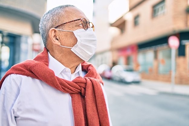 Senior man wearing medical mask CLRD Treatment