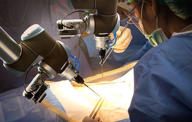a group of doctor using modern machine to do a surgery | FUTURE OF MEDICINE - Where is Medicine Going in the 2020s