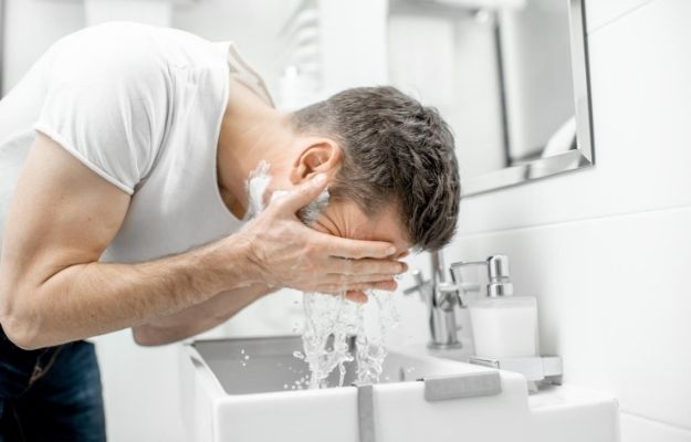 a guy washing his face | How to Treat Acne in Adult Males | How to Treat Acne in Men Fast