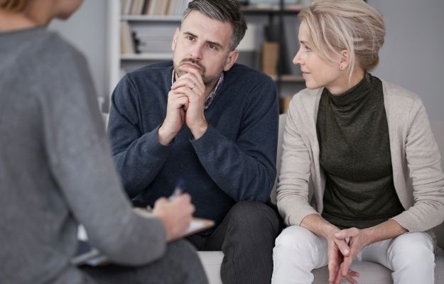 counselor is asking question with man sitting next to his wife | Talk Therapy or Counselling | Common ED Causes, Symptoms, and Treatments