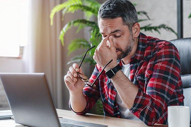 Man suffer from headache Symptoms of Atherosclerosis