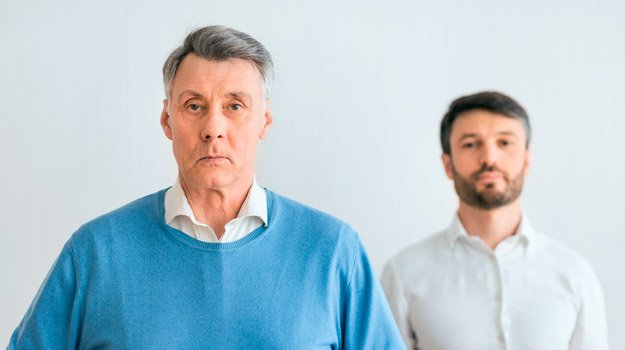 Mature man with his middle aged son portraits how parenting affects intimacy