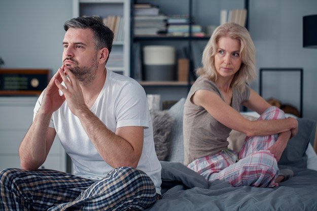 Middle aged couple turn back on each other after quarrel attachment styles