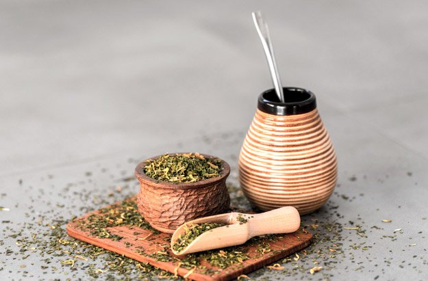 yerba-mate-drink-and-powder-on-small-wooden-plate | 5 Foods to Increase Stamina