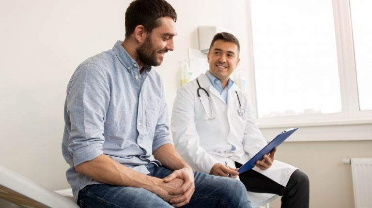 man is consulting with doctor | Feature | Benefits of Preventive Health Care