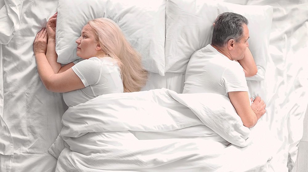 unhappy senior couple in bed | Feature | 6 Reasons Why Men Lose Interest in Sex
