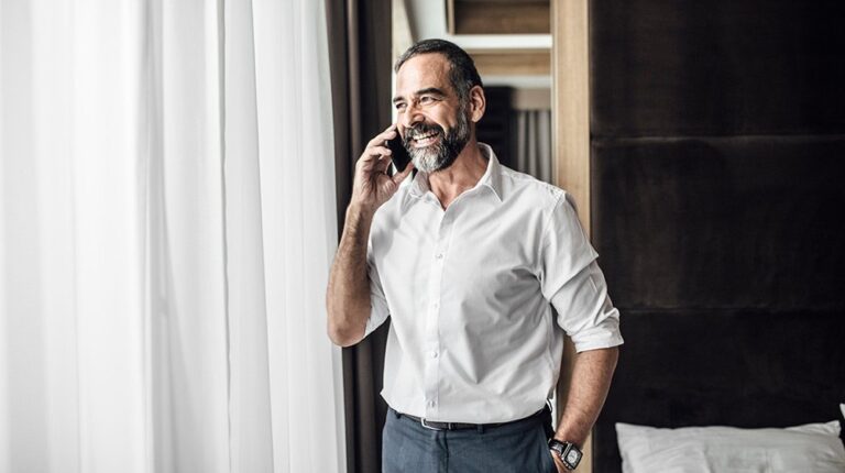 A middle age man taking on the phone | feature | Can You Slow Down Aging by Taking Human Growth Hormone?