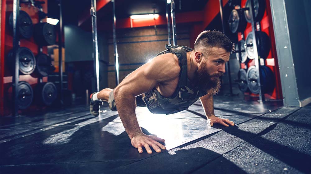 bodybuilder doing push upsr-8 Amazing Ways A Weighted Vest Can Help Improve Your Workout-ss-feature | 8 Amazing Ways A Weighted Vest Can Help Improve Your Workout