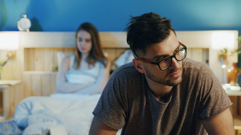 Blurred image of young man in glasses sadly sittin…igns That You Need a Testosterone Test | feature | 12 Signs That You Need a Testosterone Test