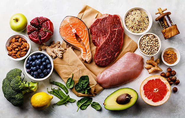 A table of healthy food, vegetable, salmon, chicken breast, fruit, bean | How A Strong Immune System Could Be The Best Response To COVID-19 & Its Variants